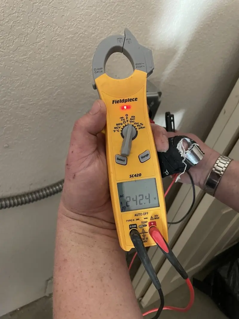 Voltage testing with clamp meter during Recessed Lighting Installation in Knob Noster